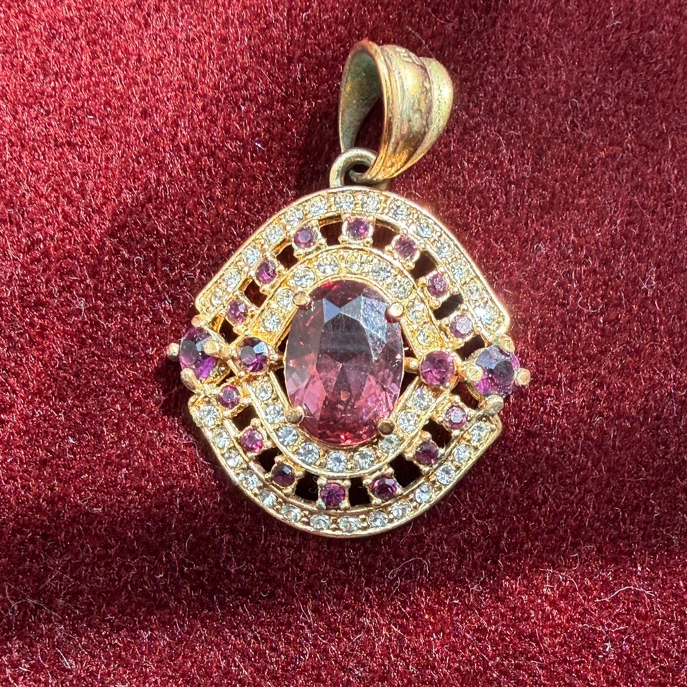 Gold-Tone Pink Crystal Oval Pendant Necklace

2”